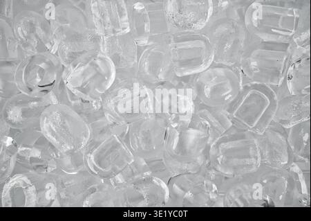 Close up view of many ice cubes filling the entire frame creating a cold and refreshing abstract background. Concept of freshness, cooling, beverage Stock Photo