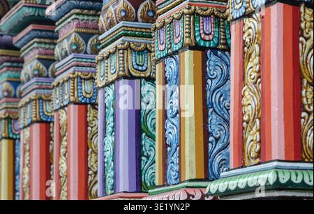 Bangkok, Thailand - Jan 02, 2023 - A side-angle view of the square, polychromatic pillars at the Sri Maha Mariamman Temple, showcasing a vibrant maste Stock Photo