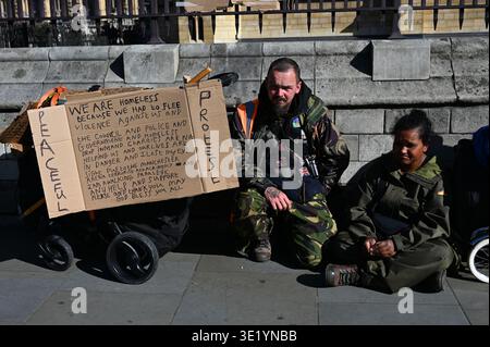 LONDON, ENGLAND - MARCH 17 2026: A woman who was born in Birmingham and is a Bangladeshi descendant, and a man from Manchester are fleeing violence from the women's community. She was forced to marry and return to Bangladesh, resulting in her divorce. She met a man from Manchester in Birmingham. He is disabled; his entire family neglects him. She is responsible for taking care of and looking after him. The Bangladeshi neighbors don't like them and they attack them with a machete. So they flee to London and are now homeless. They are now seeking shelter from the council. Provide the council wit Stock Photo