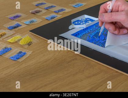 DIY diamond painting. Diamond embroidery with a pen. Stock Photo