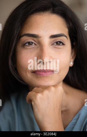 Close up portrait of young thoughtful Latina woman Stock Photo