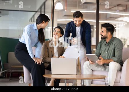 Diverse business team collaborating on project strategy in office Stock Photo