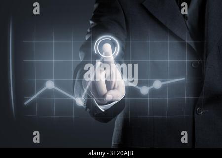 Businessman navigating data in chart on futuristic touchscreen display Stock Photo