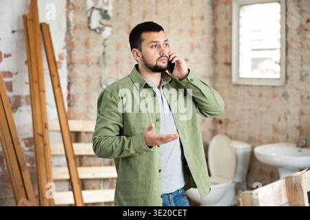 Civil engineer is talking on the phone Stock Photo