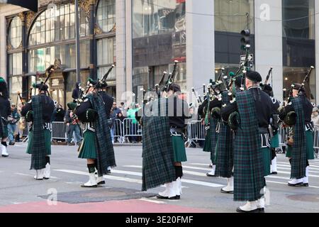 NEW YORK, NY - MARCH 17, 2026: A pipe band in traditional green tartans Kilts marches and plays bagpipes Fifth Avenue   St. Patrick's Day Parade 2026 Stock Photo