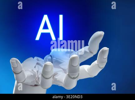 Robot hand holding virtual AI sign against blue gradient background. Artificial intelligence concept Stock Photo
