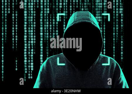 Cybercriminal in hood against binary code. Digital security Stock Photo