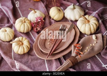 Autumn tablescape with pumpkins and elegant rustic decor Stock Photo