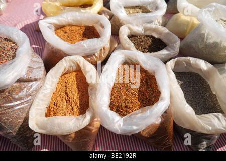 Spices on display at a market in the afternoon sun Stock Photo