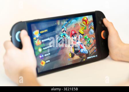 Child playing Nintendo Swtich 2 Mario Kart World Game Stock Photo