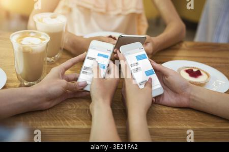 Friends texting on their smartphones Stock Photo