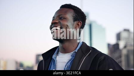 Education, smile and thinking with black man in city for college or university opportunity. Inspiration, learning and study with happy African student Stock Photo