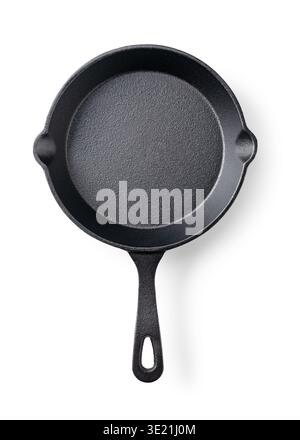 Empty cast iron skillet isolated on white background, top view Stock Photo