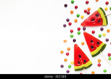 Sweet summer background, waretmelon lollipops on white, copy space Stock Photo