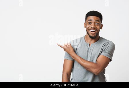 African-american man pointing aside at copy space Stock Photo