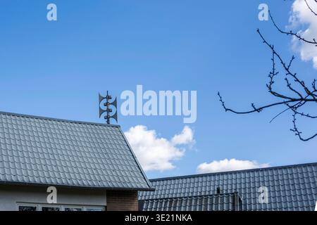 Sirens on a rooftop against a blue sky Stock Photo