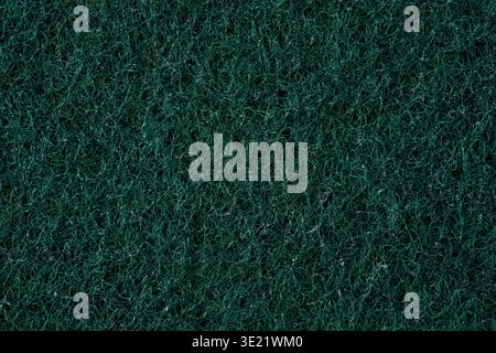 Dark rough kitchen sponge texture with dense fiber abstract background Stock Photo