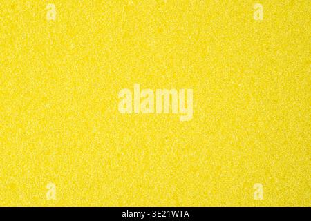 Bright yellow sponge texture with porous abstract cleaning background Stock Photo