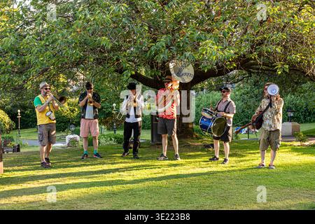 Evening light on live music in the gardens beside the Palace Hotel at Buxton, Derbyshire, England UK Stock Photo