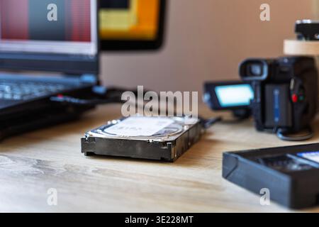 Digitizing Old VHS Video Cassette to Hard Drive Using VCR Player Stock Photo