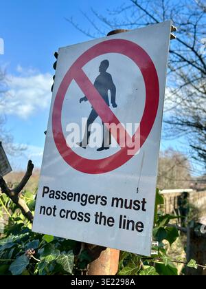 Passengers must not cross the line sign Stock Photo