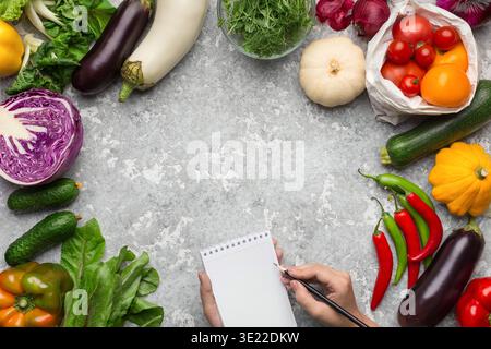 Vegetables frame and blank notebook top view Stock Photo