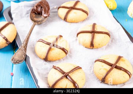 Hot cross bun crumble cookies with cross on it, made with chocolate paste topping, simple Easter holiday dessert idea Stock Photo