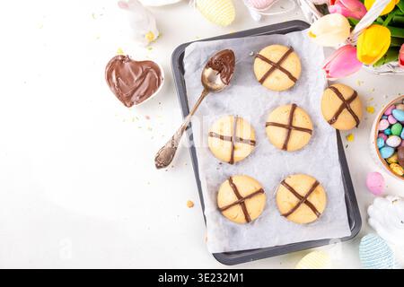 Hot cross bun crumble cookies with cross on it, made with chocolate paste topping, simple Easter holiday dessert idea Stock Photo