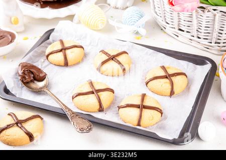 Hot cross bun crumble cookies with cross on it, made with chocolate paste topping, simple Easter holiday dessert idea Stock Photo