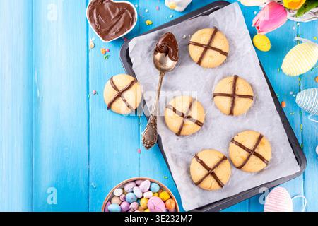 Hot cross bun crumble cookies with cross on it, made with chocolate paste topping, simple Easter holiday dessert idea Stock Photo