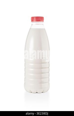A plastic bottle with milk or other opaque white drink on a white background is an isolate, an object studio vertical photograph in the minimalist sty Stock Photo