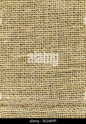 Natural sacking burlap background. Natural light brown burlap fabric texture. Sackcloth woven texture background Stock Photo