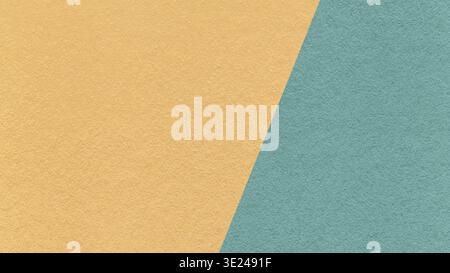 Light ochre texture background with muted teal diagonal angled split and copy space for template, banner, presentation. Stock Photo