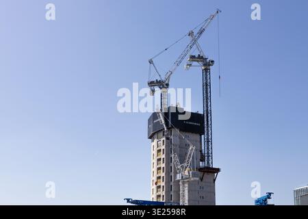 Tall skyscraper under construction with tower cranes. London, UK, 26 May 2023 Stock Photo