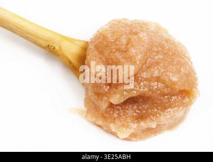 Salty caviar of alaska pollock in wooden spoon on white plate close up Stock Photo