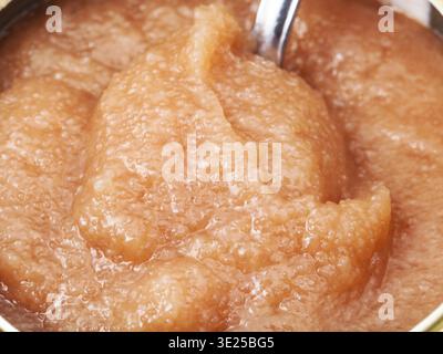 Salty caviar of alaska pollock with spoon in can close up Stock Photo