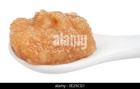 Salty caviar of alaska pollock in ceramic spoon isolated on white background Stock Photo
