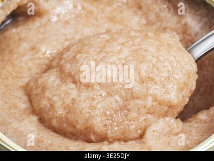 Salty caviar of zander fish with spoon in can close up Stock Photo