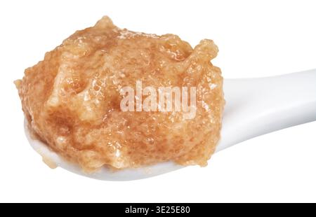 Salty caviar of zander fish in ceramic spoon isolated on white background Stock Photo