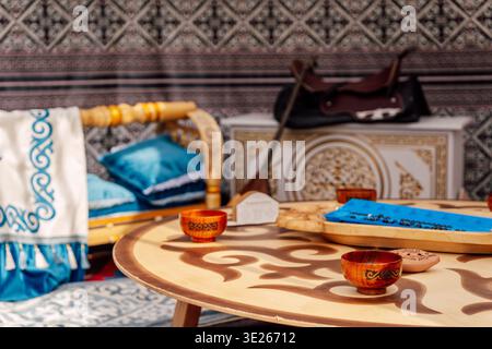 Rustic Table Scene. Intimate Setting Featuring Carved Bowls And Spirited Social Interaction Stock Photo