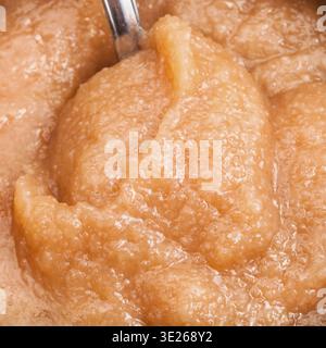 Surface of salty caviar of alaska pollock with spoon in can close up Stock Photo