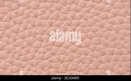 The texture of soft natural leather in a delicate pink color with a characteristic fine-grained pattern, full frame Stock Photo