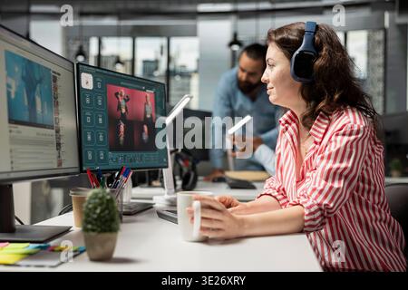AI virtual assistant, listening to focus music, editor generating photos using chatbot to produce visuals for commercial content. Woman photographer editing images generated from prompts. Stock Photo