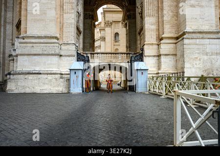 Vatican City, Vatican City, Aug 29 2024.Traditional guards positioned at a grand gateway reflect the identity and historic atmosphere of Vatican City. Stock Photo