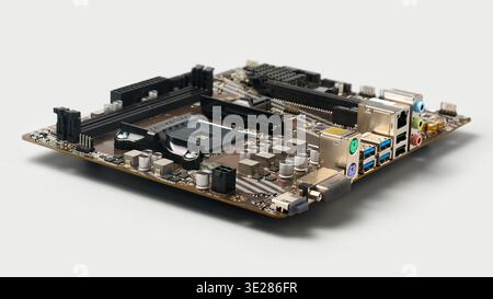 desktop computer motherboard isolated light gray background, empty cpu socket and memory slots with electronic components, angle view with soft focus Stock Photo