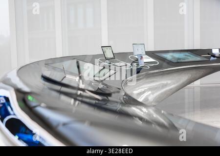 Sleek futuristic car interior with embedded tablets and digital displays, showcasing advanced Stock Photo