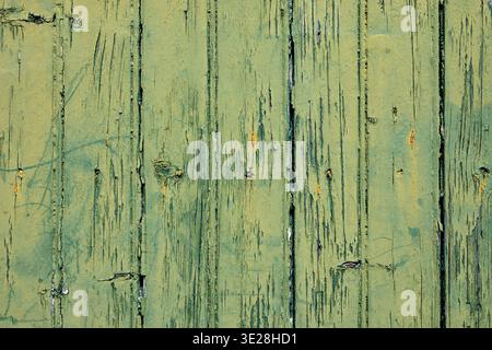 Full Frame Texture of Weathered Green Wood Planks with Peeling Paint Stock Photo