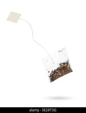 Filter tea bag with blanck label floating, isolated on white background. Stock Photo