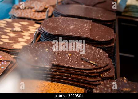 Handmade Swiss chocolate slabs in Zermatt shop, nuts and mix ins Stock Photo