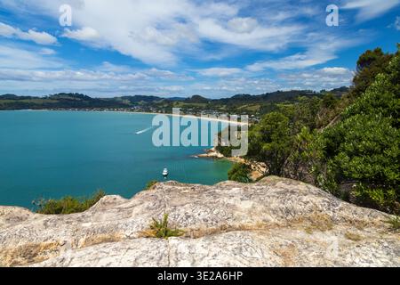 A view of Cooks Bay, part of the larger Mercury Bay on the Coromandel Peninsula, New Zealand. The town of Cooks Beach lies on the shoreline Stock Photo